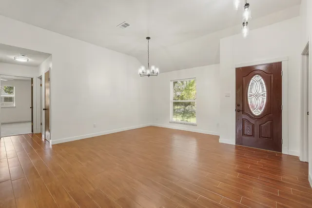 a view of a livingroom with wooden floor