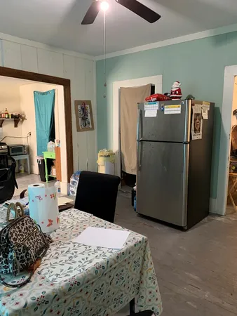 a kitchen with a stove and a refrigerator