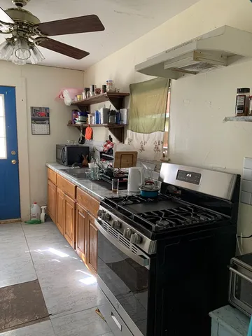 a kitchen with a stove and a refrigerator