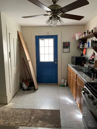 a view of hallway with wooden floor