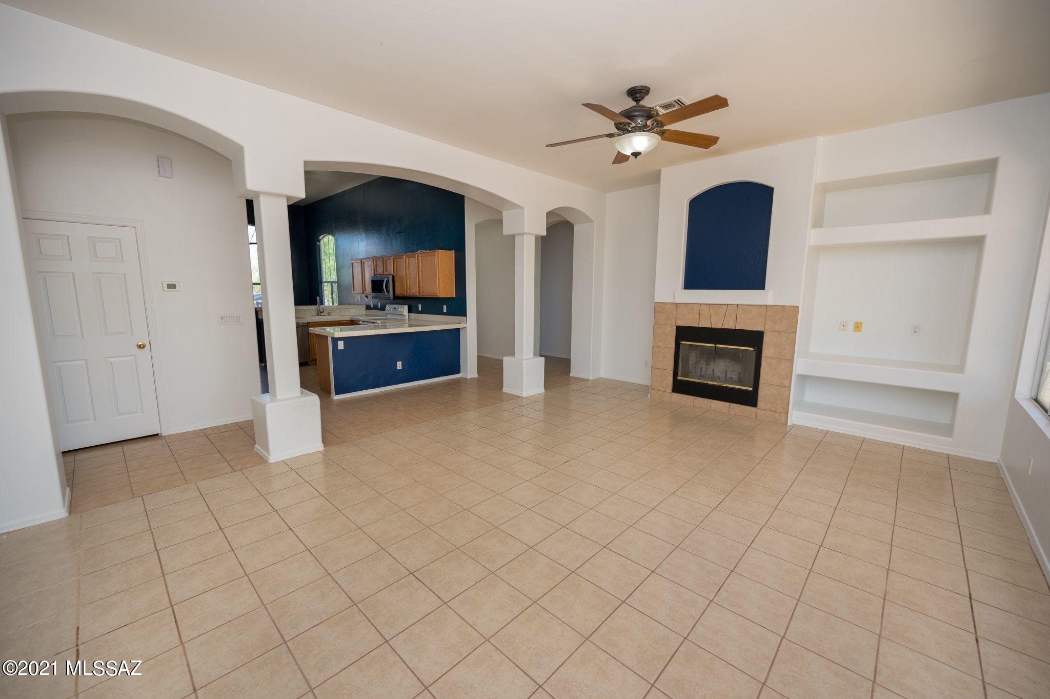 131 Alemania Court Rio Rico, AZ 85648 - Photo 11 of 47 a view of living room with furniture and a fireplace