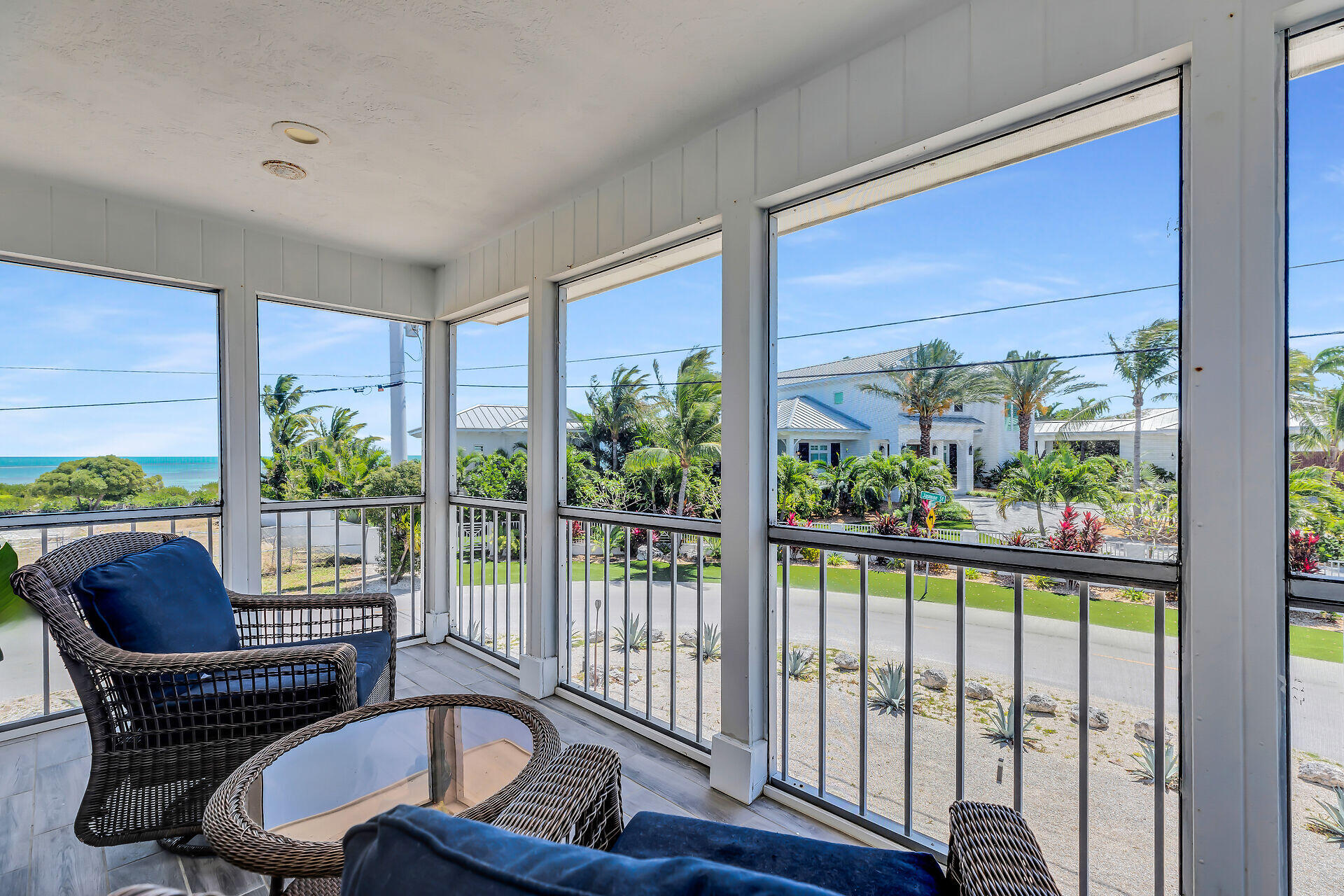 309 Jasmine Street Duck Key, FL 33050 - Photo 14 of 37 a balcony view with a couch and large windows