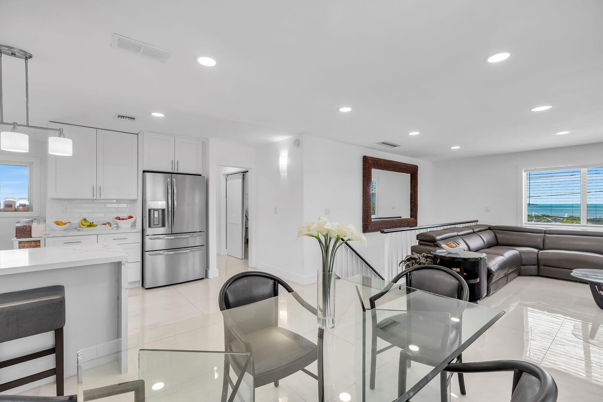 309 Jasmine Street Duck Key, FL 33050 - Photo 17 of 37 a kitchen with refrigerator and chairs