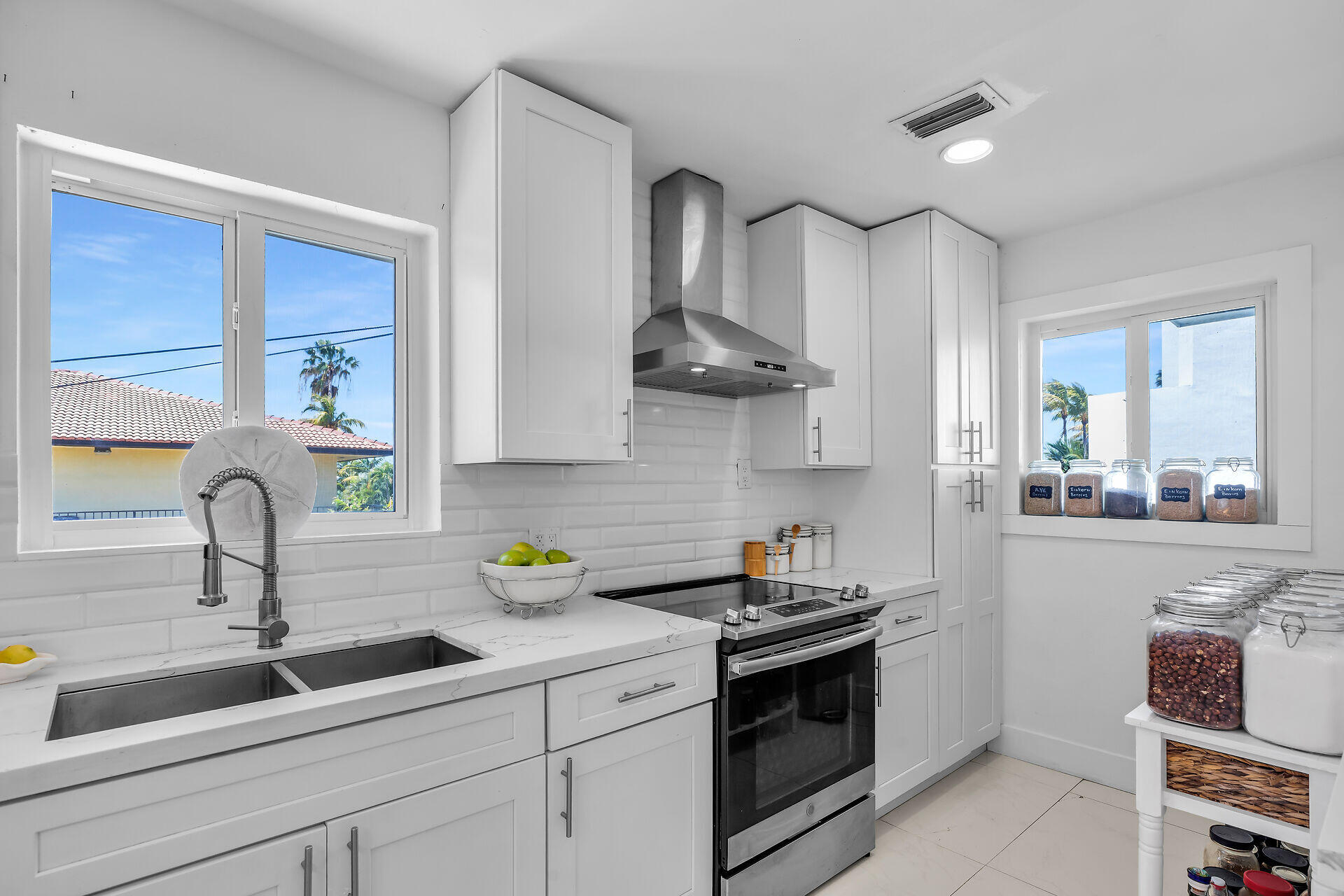 309 Jasmine Street Duck Key, FL 33050 - Photo 20 of 37 a kitchen with stainless steel appliances a sink stove and cabinets