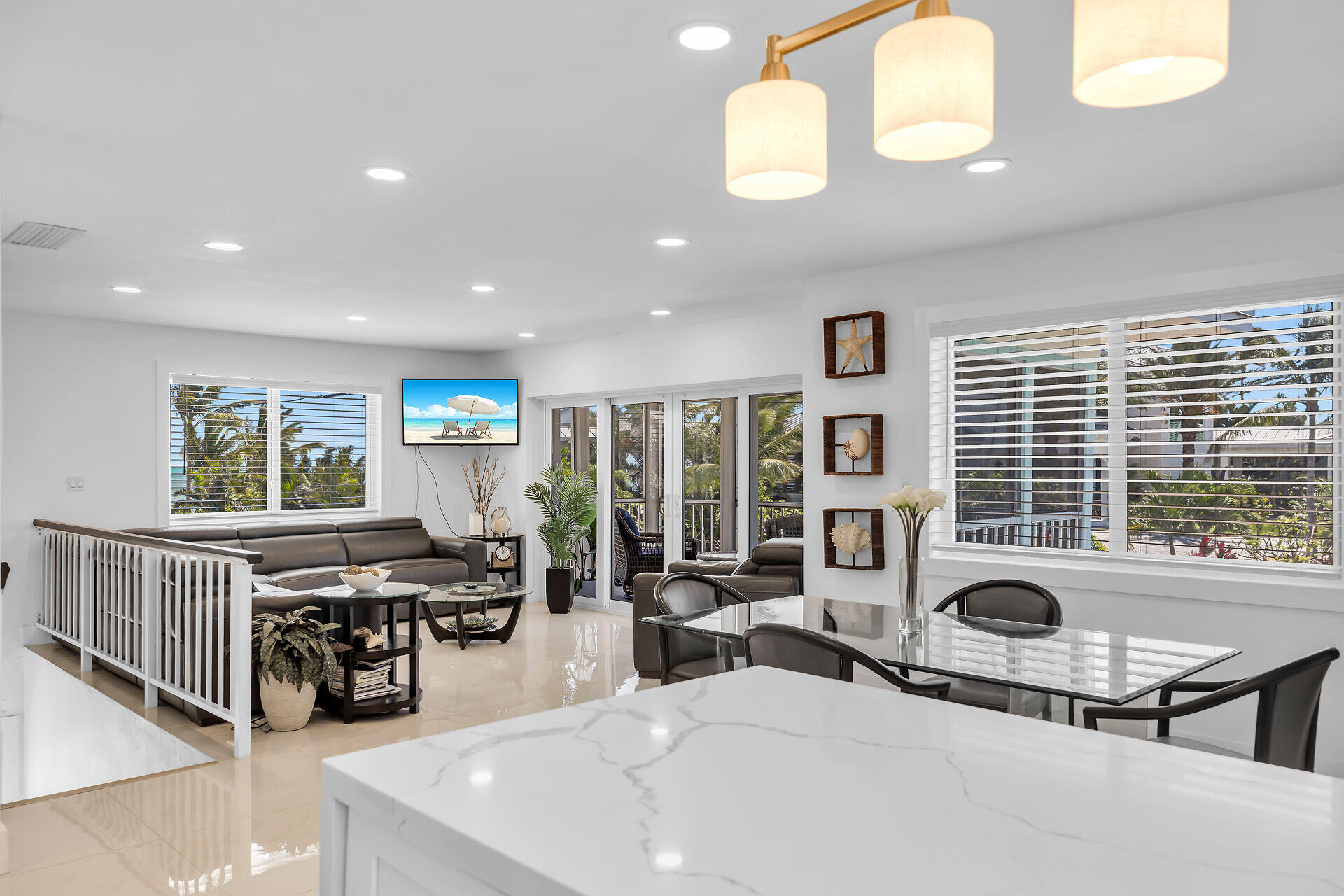 309 Jasmine Street Duck Key, FL 33050 - Photo 21 of 37 a living room with furniture a large window and potted plants