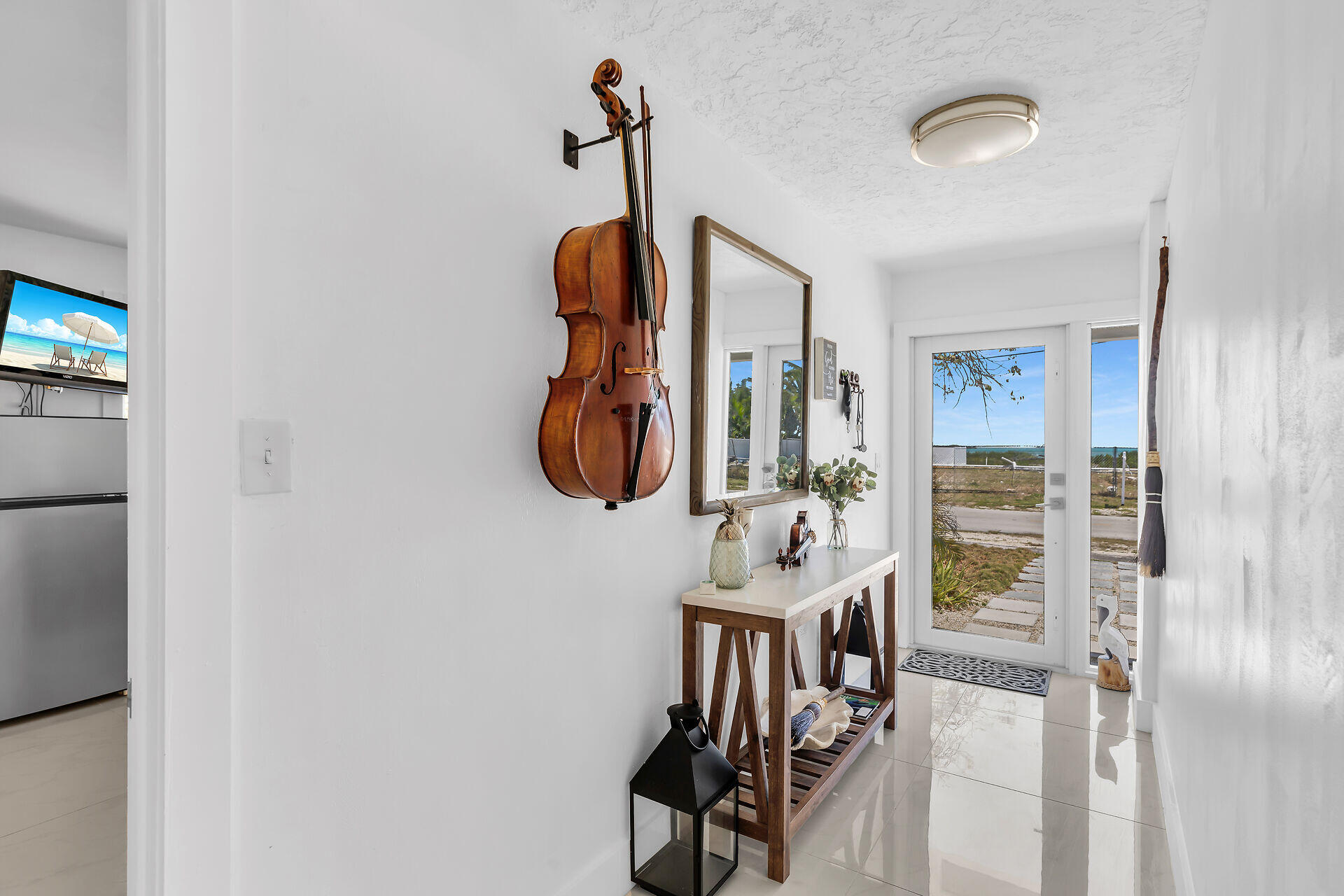 309 Jasmine Street Duck Key, FL 33050 - Photo 27 of 37 a view of a hallway with wooden furniture