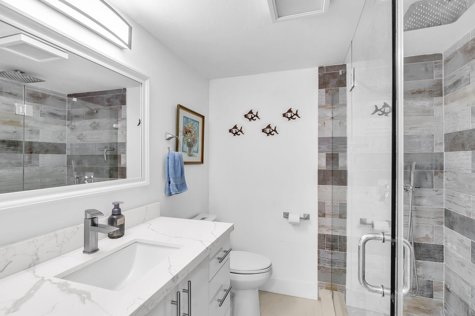 309 Jasmine Street Duck Key, FL 33050 - Photo 28 of 37 a bathroom with a sink toilet and shower