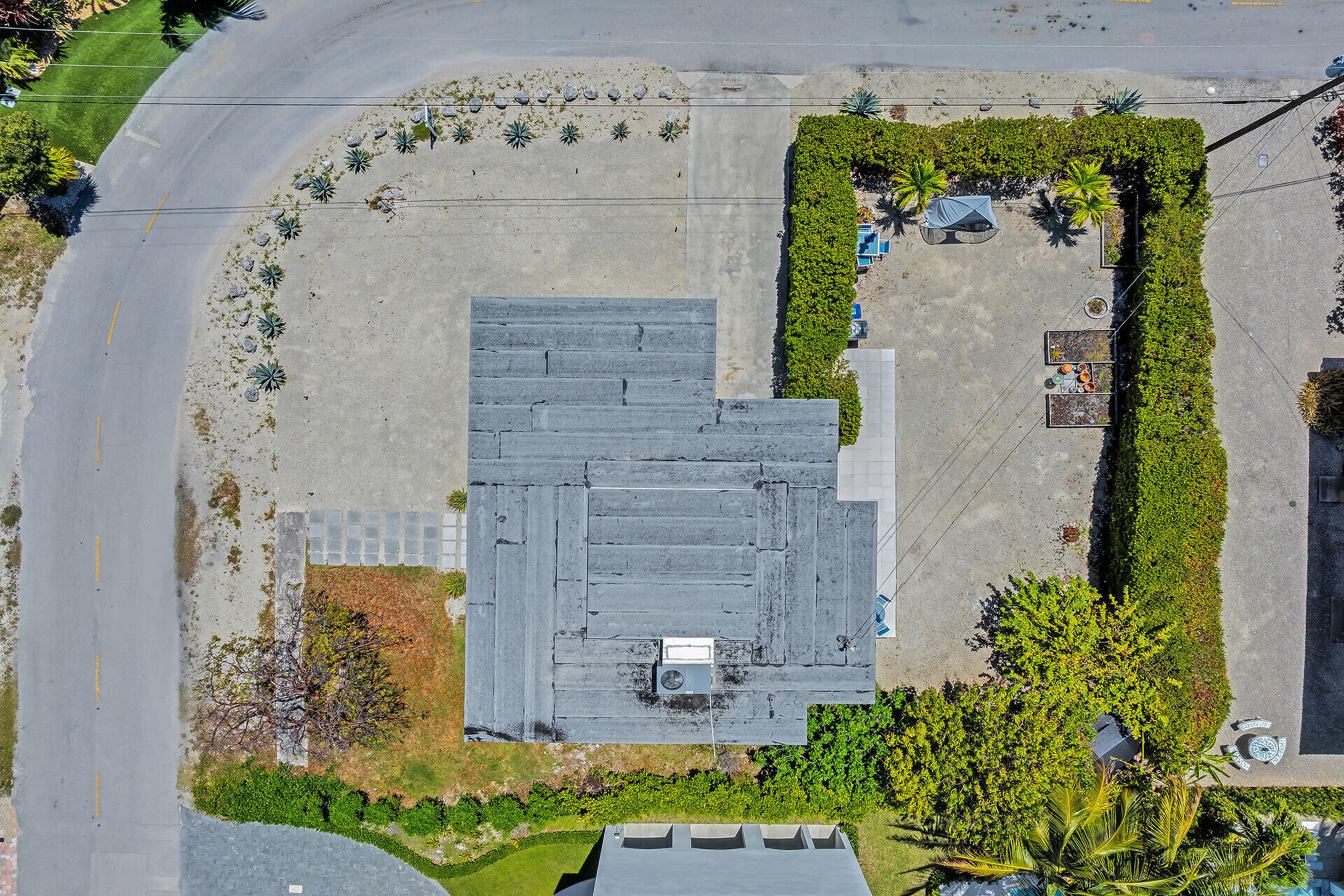 309 Jasmine Street Duck Key, FL 33050 - Photo 5 of 37 an aerial view of a house with a yard and potted plants