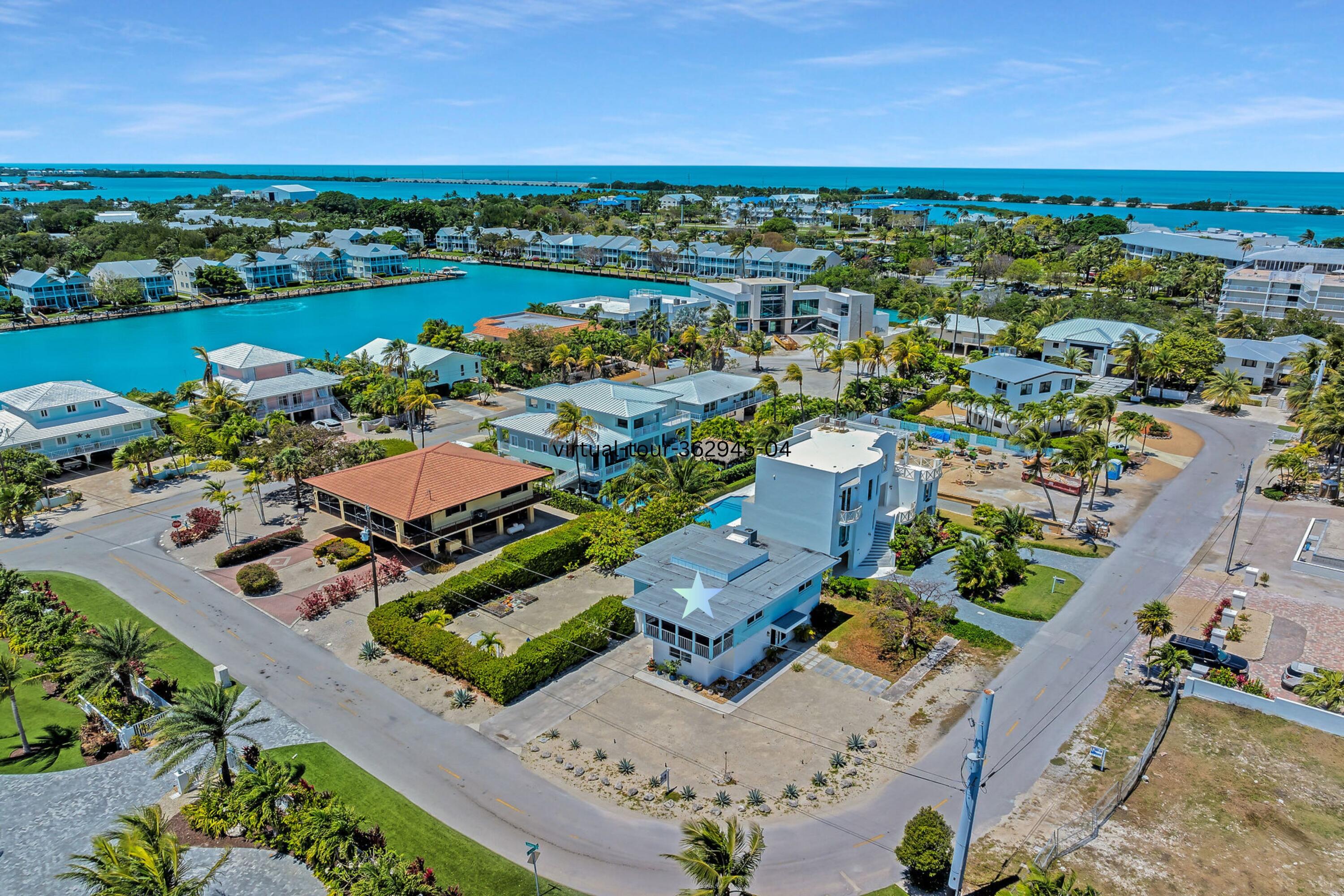 309 Jasmine Street Duck Key, FL 33050 - Photo 8 of 37 an aerial view of a house with a lake view