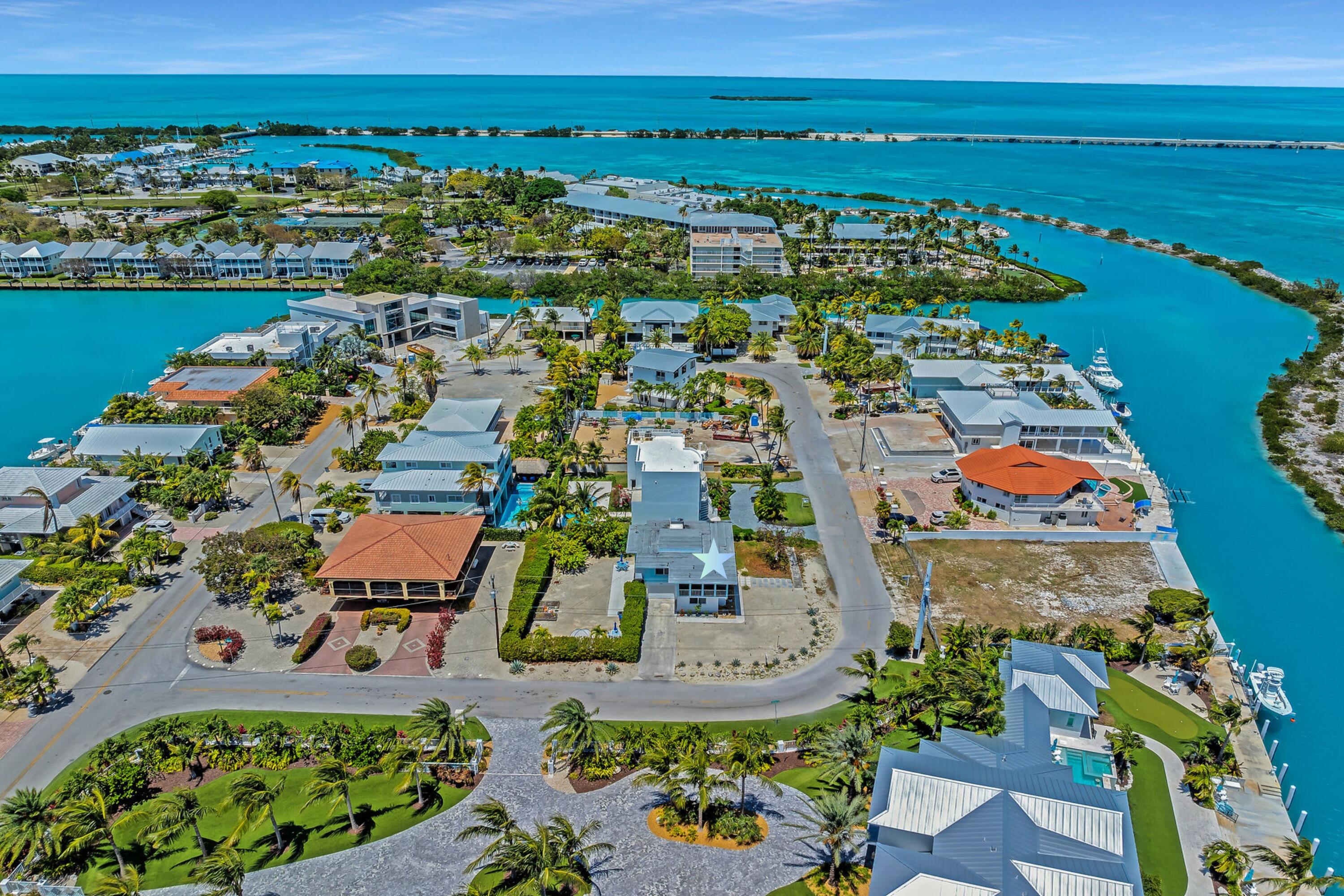 309 Jasmine Street Duck Key, FL 33050 - Photo 9 of 37 an aerial view of residential building and lake