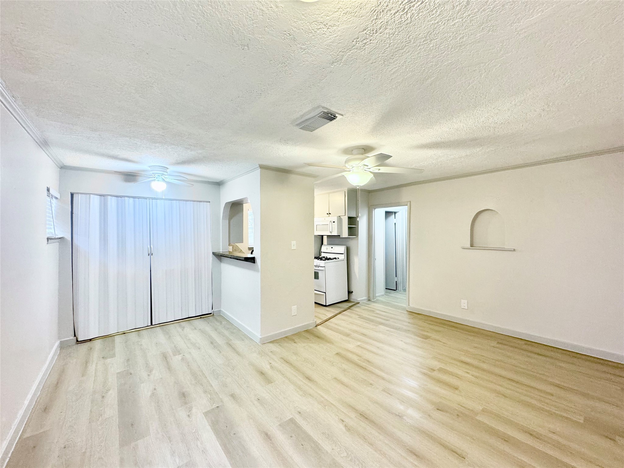 1307 Willard Street, Unit 4 Houston, TX 77006 - Photo 1 of 26 a view of empty room with wooden floor