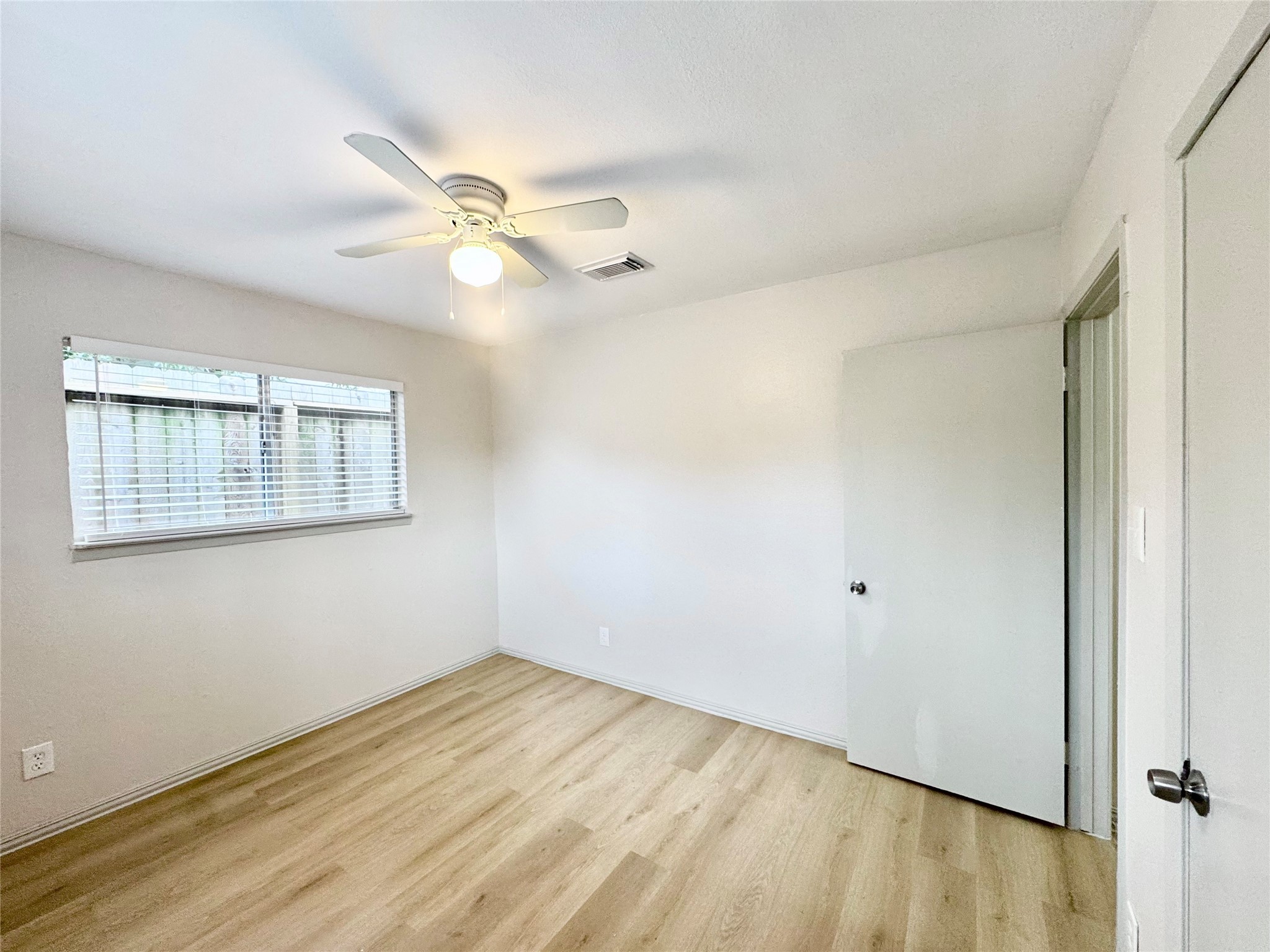 1307 Willard Street, Unit 4 Houston, TX 77006 - Photo 16 of 26 wooden floor in an empty room