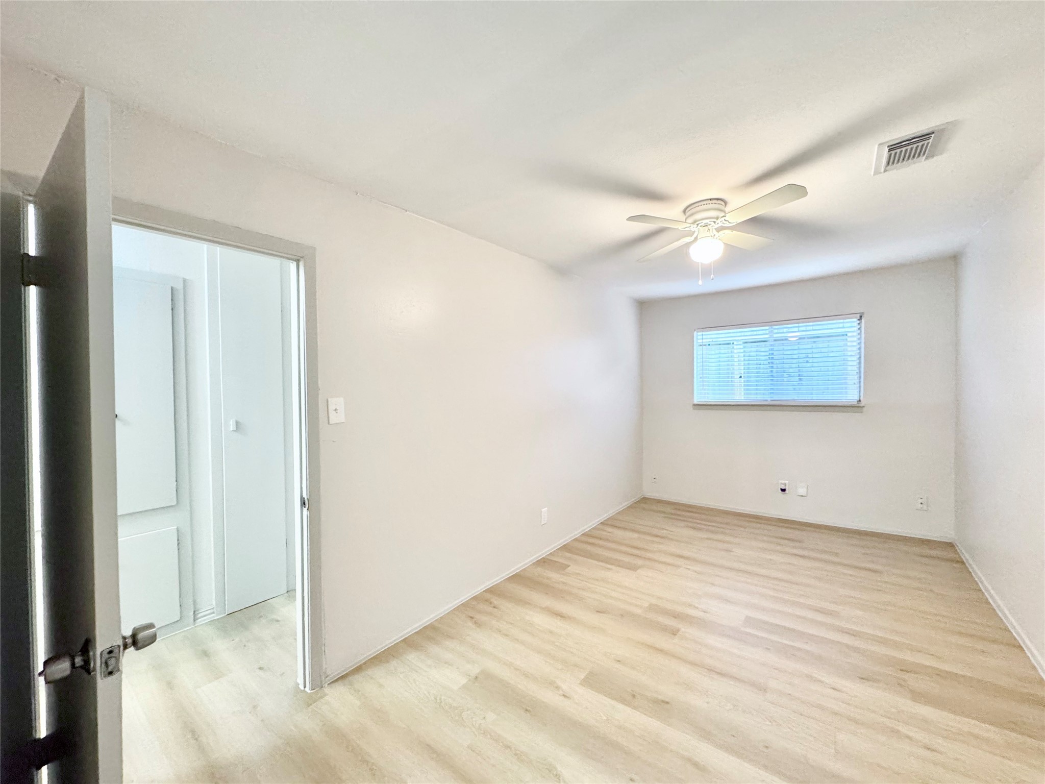 1307 Willard Street, Unit 4 Houston, TX 77006 - Photo 20 of 26 a view of an empty room with a window