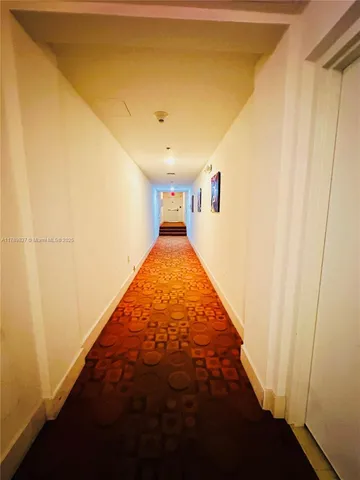 a view of a hallway with a yellow space