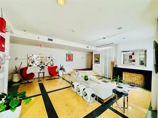 a view of a dining room with furniture and a flat screen tv