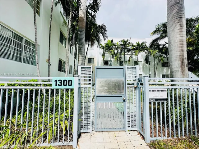 a view of a house with a small yard and plants