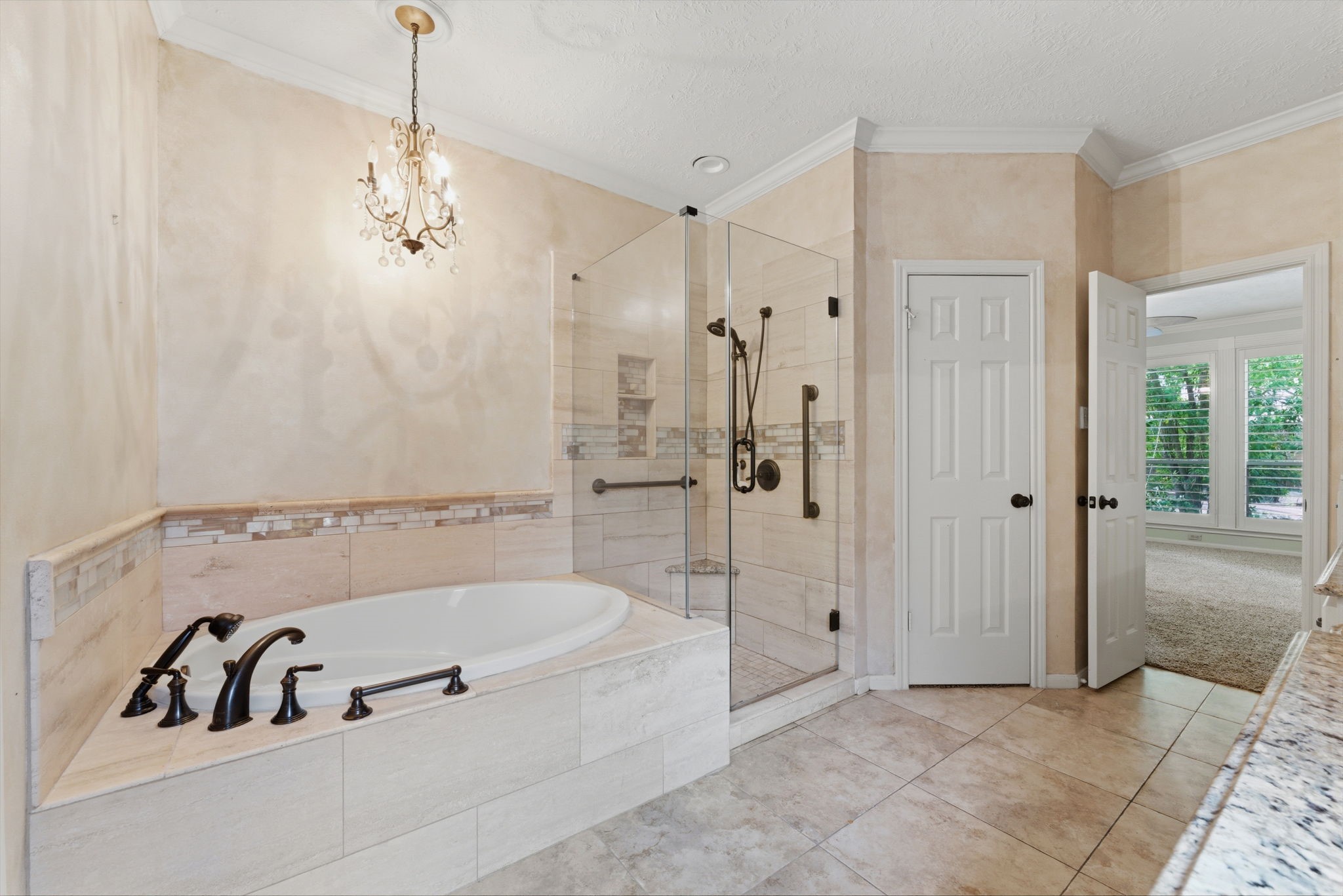 13807 Balmore Circle Houston, TX 77069 - Photo 17 of 30 a bathroom with a tub and a shower
