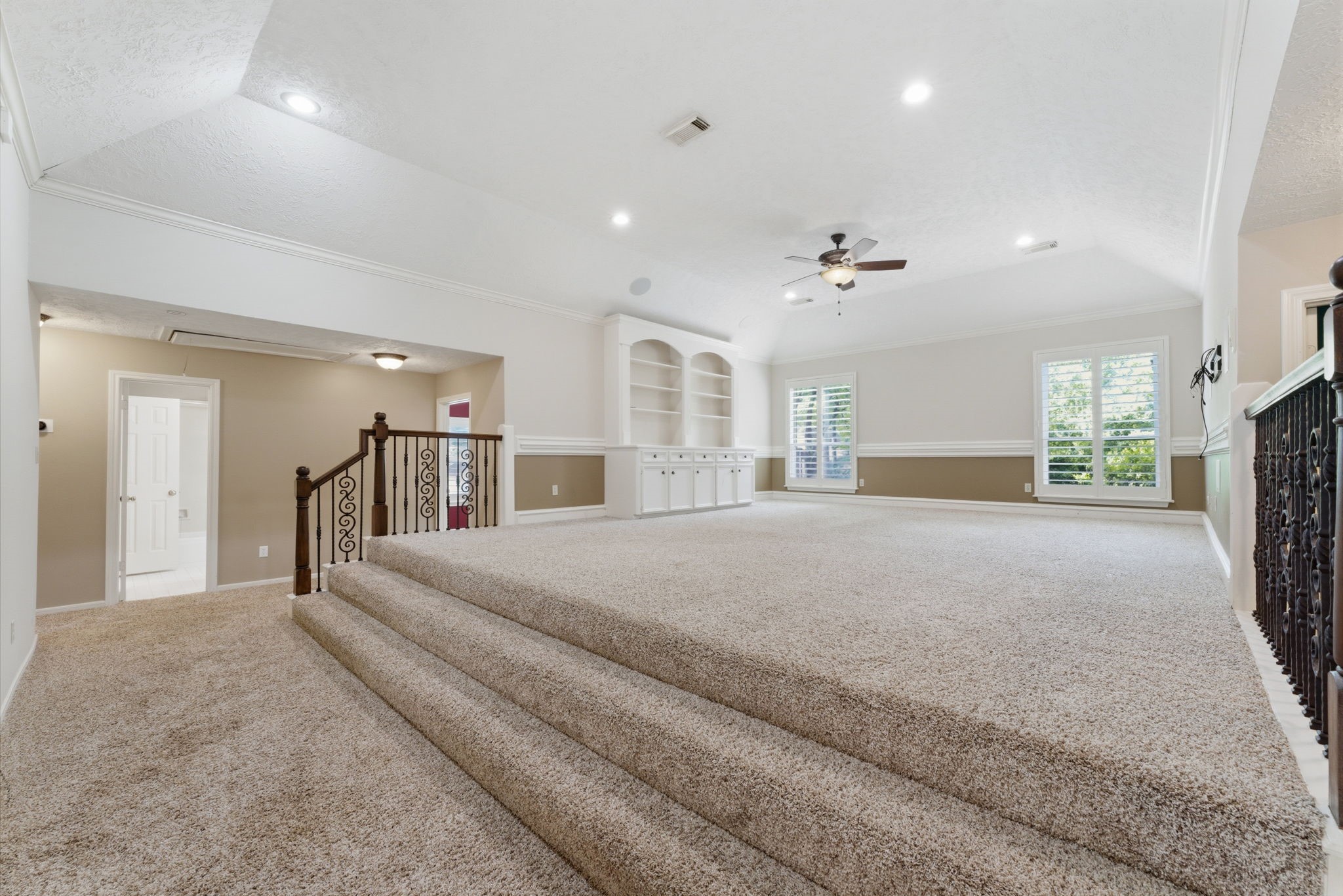 13807 Balmore Circle Houston, TX 77069 - Photo 18 of 30 a spacious bedroom with a large bed and a chandelier