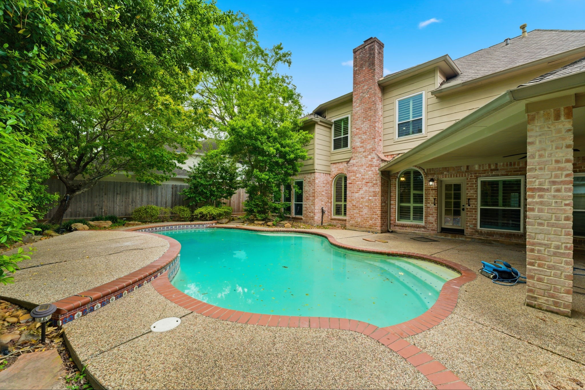 13807 Balmore Circle Houston, TX 77069 - Photo 2 of 30 a view of a house with pool yard and chairs