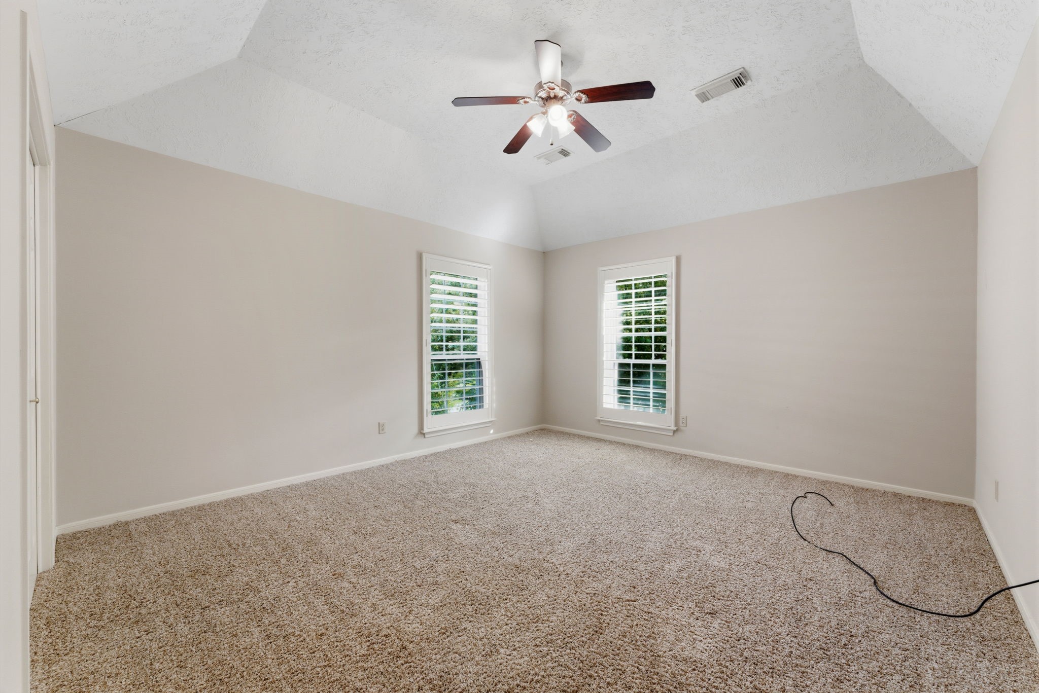 13807 Balmore Circle Houston, TX 77069 - Photo 21 of 30 a view of a livingroom with a ceiling fan and window