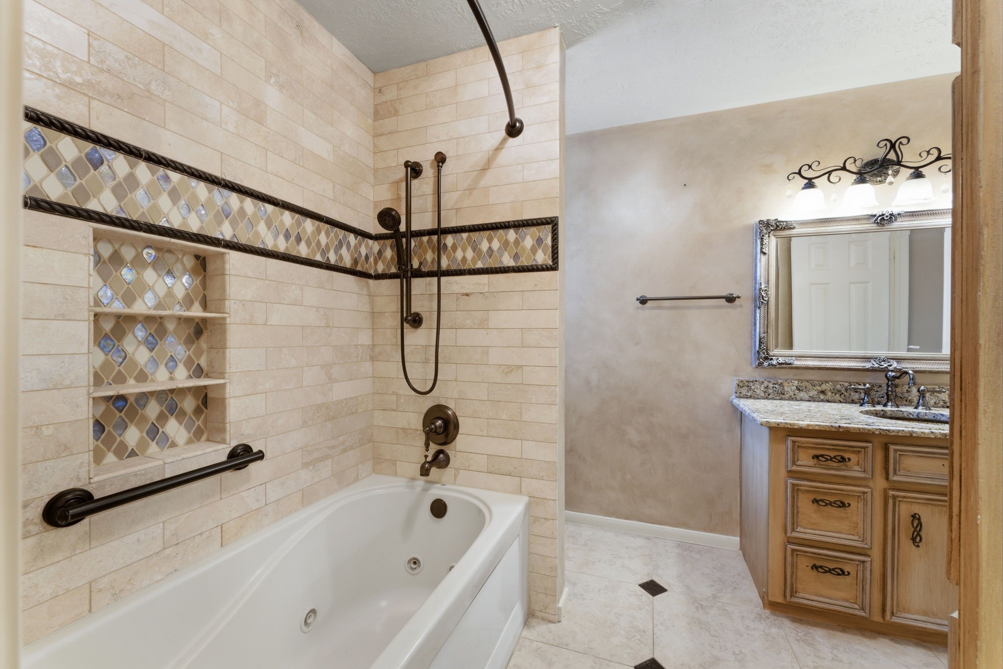 13807 Balmore Circle Houston, TX 77069 - Photo 23 of 30 a bathroom with a tub sink and mirror