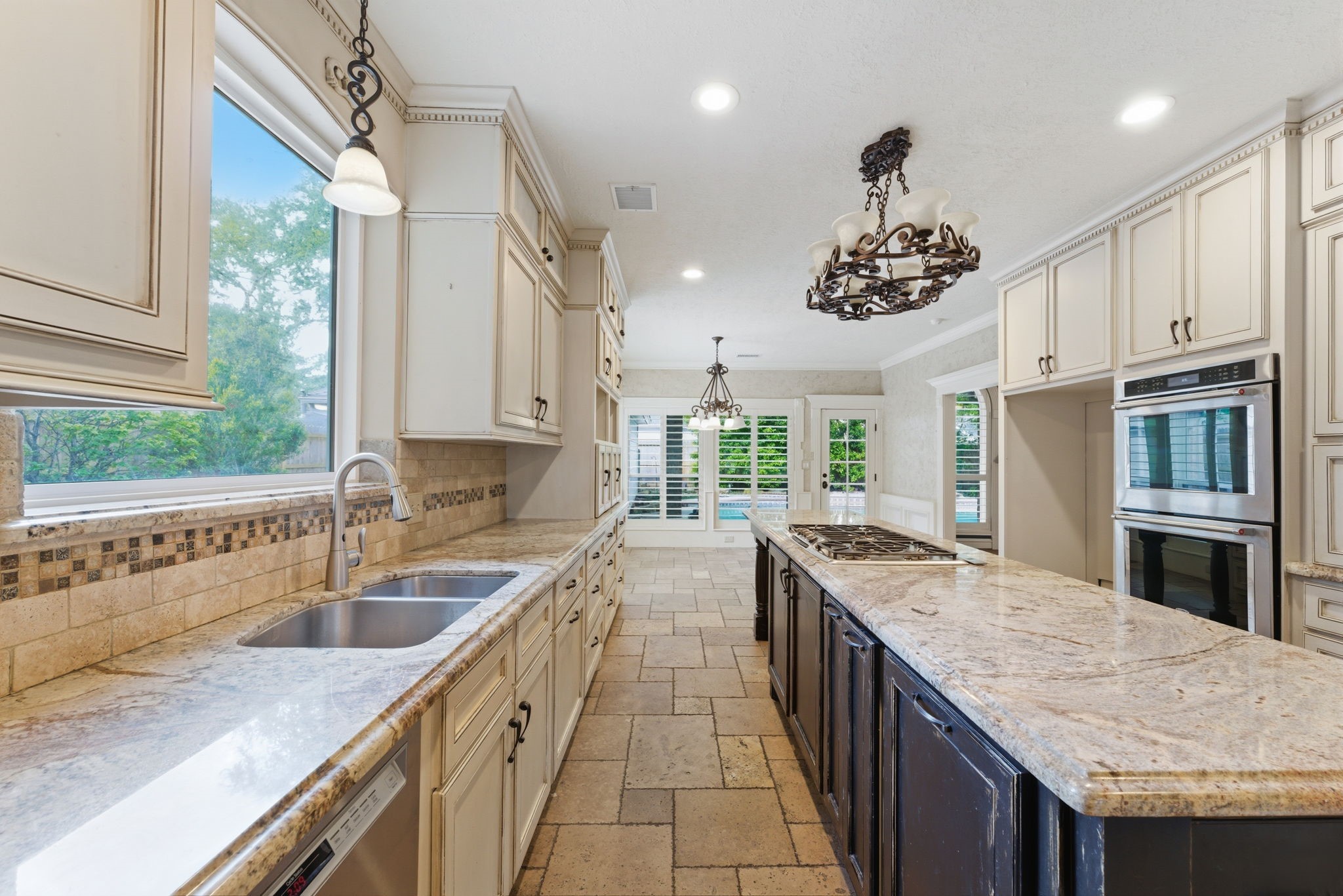 13807 Balmore Circle Houston, TX 77069 - Photo 7 of 30 a kitchen with stainless steel appliances granite countertop a sink stove and cabinets
