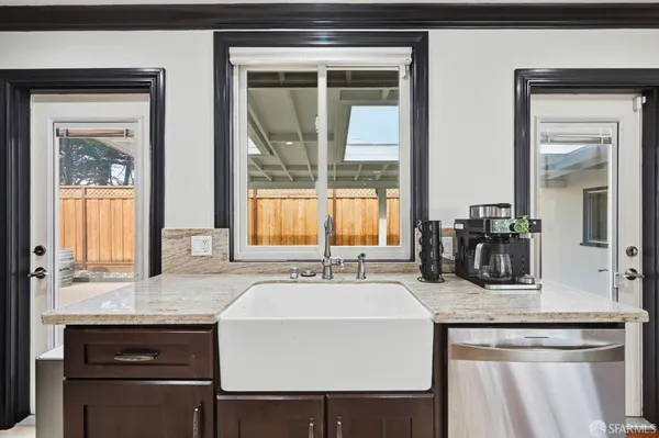 a kitchen with stainless steel appliances granite countertop a stove and a sink