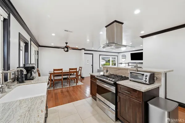 a view of a kitchen with electric appliances