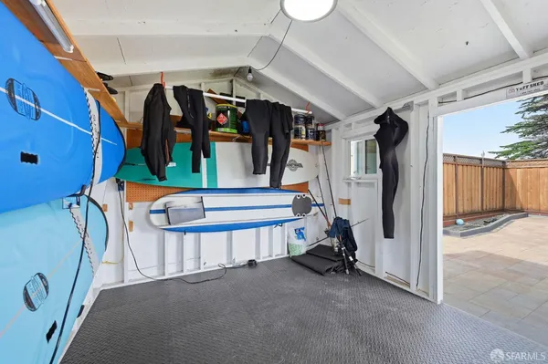 a bathroom with a shower and a sink