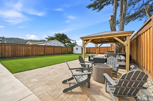 a view of yard with swimming pool outdoor seating