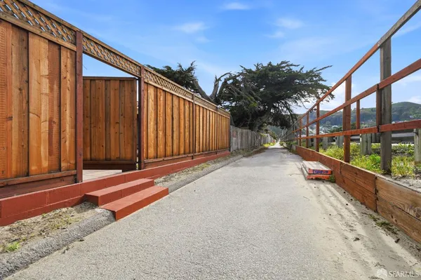 an aerial view of residential houses with yard
