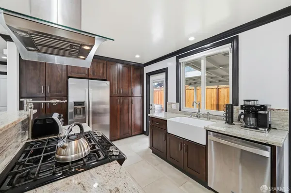 a kitchen with a sink and a refrigerator