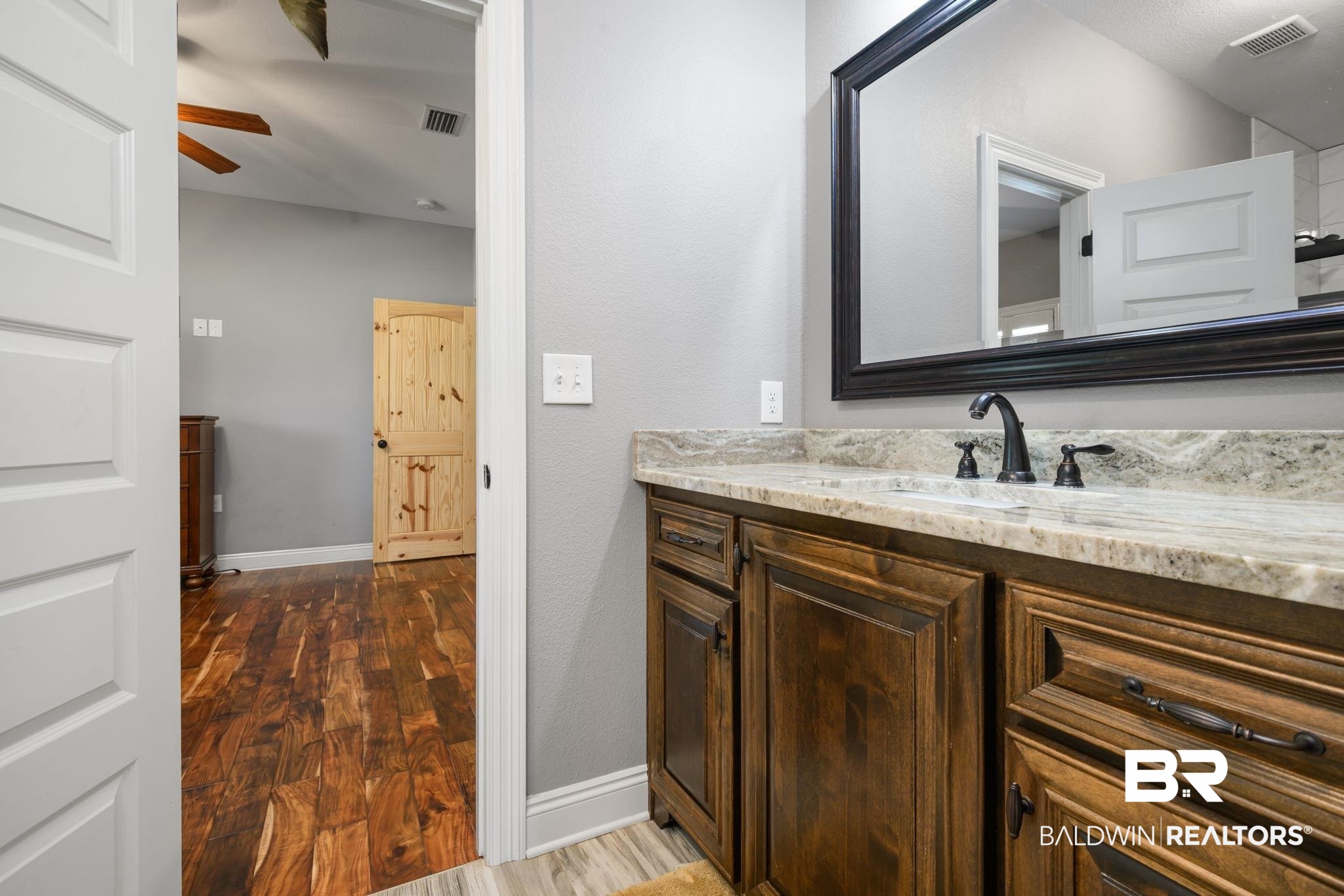 52579 Stockton Cemetery Road Stockton, AL 36507 - Photo 26 of 66 Bathroom featuring vanity, dark wood-type flooring, and ceiling fan