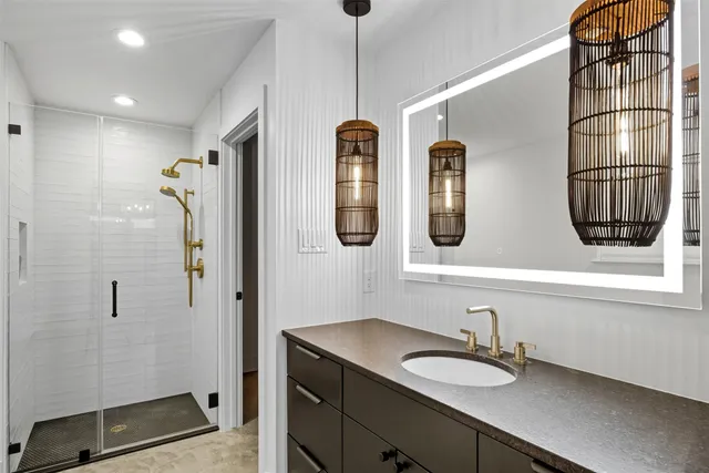 a bathroom with a sink and a mirror