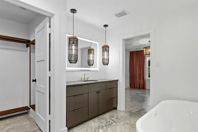 a bathroom with a bathtub and a shower