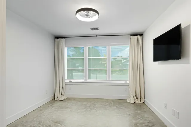 a living room with stainless steel appliances kitchen island granite countertop furniture and a view of kitchen