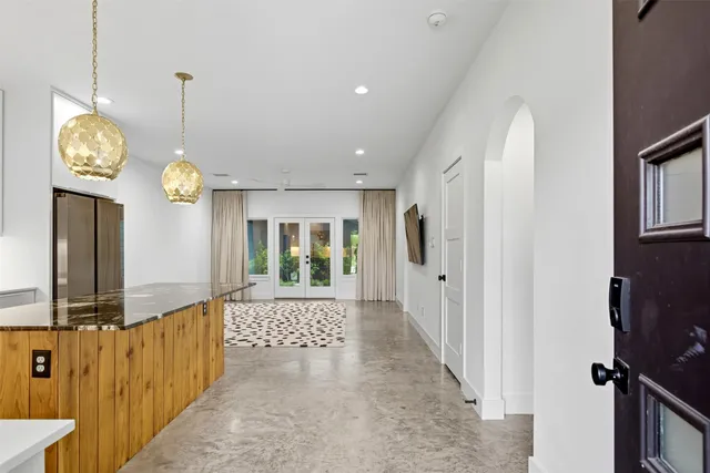 a view of a hallway with windows