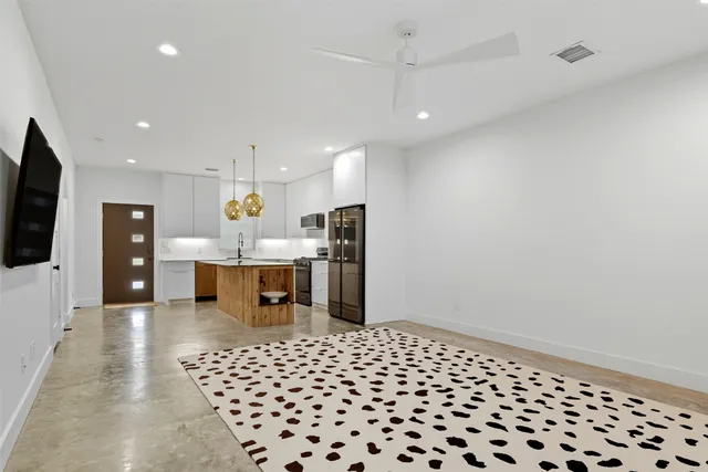 a living room with a black white checkered floor with a black white checkered floor