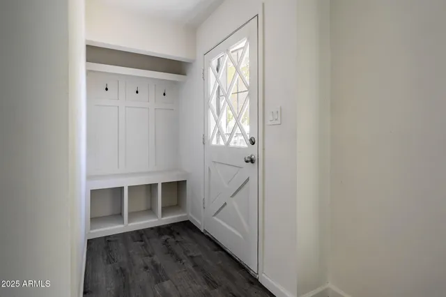 a bedroom with a bed and a flat screen television