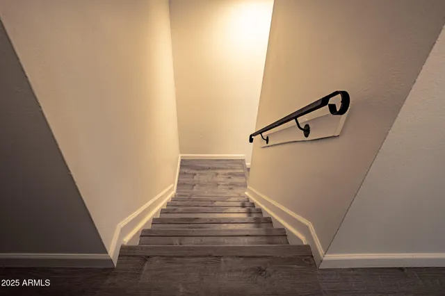 a view of an entryway with wooden floor
