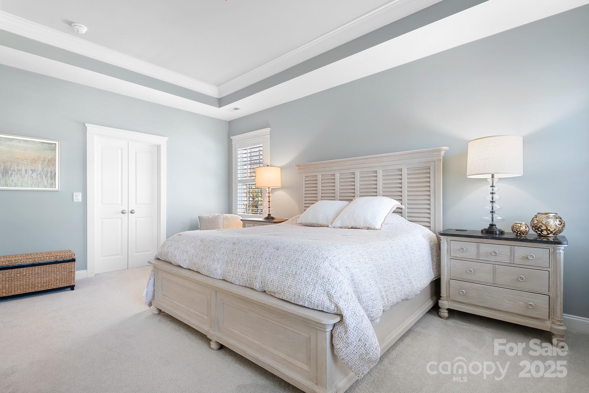 15826 Trenton Place Road Huntersville, NC 28078 - Photo 13 of 32 a spacious bedroom with a bed and a lamp