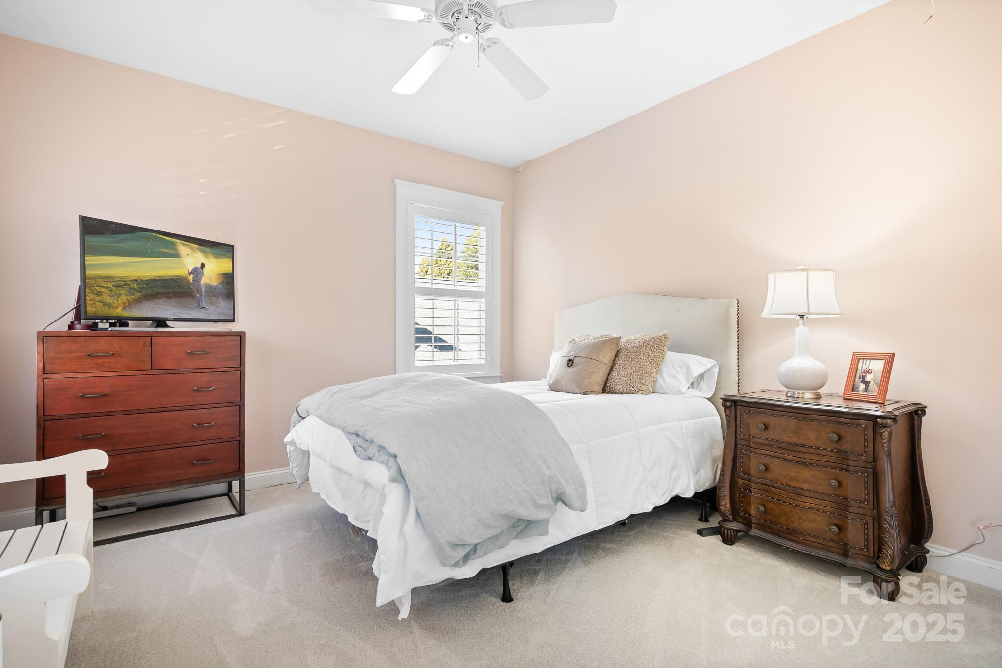 15826 Trenton Place Road Huntersville, NC 28078 - Photo 19 of 32 a bedroom with a bed and a dresser