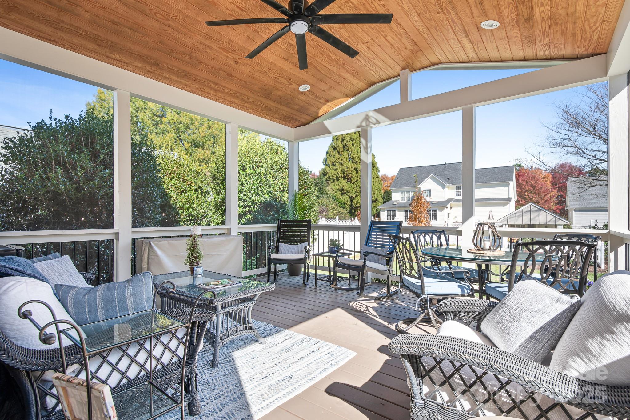 15826 Trenton Place Road Huntersville, NC 28078 - Photo 9 of 32 a living room with furniture and floor to ceiling windows