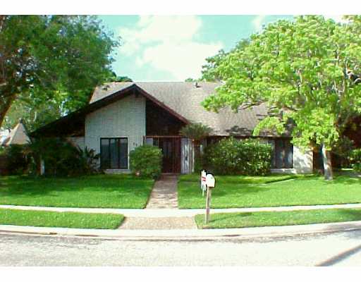 a house with a yard and a fountain