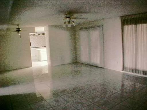 a view of a room with a fireplace