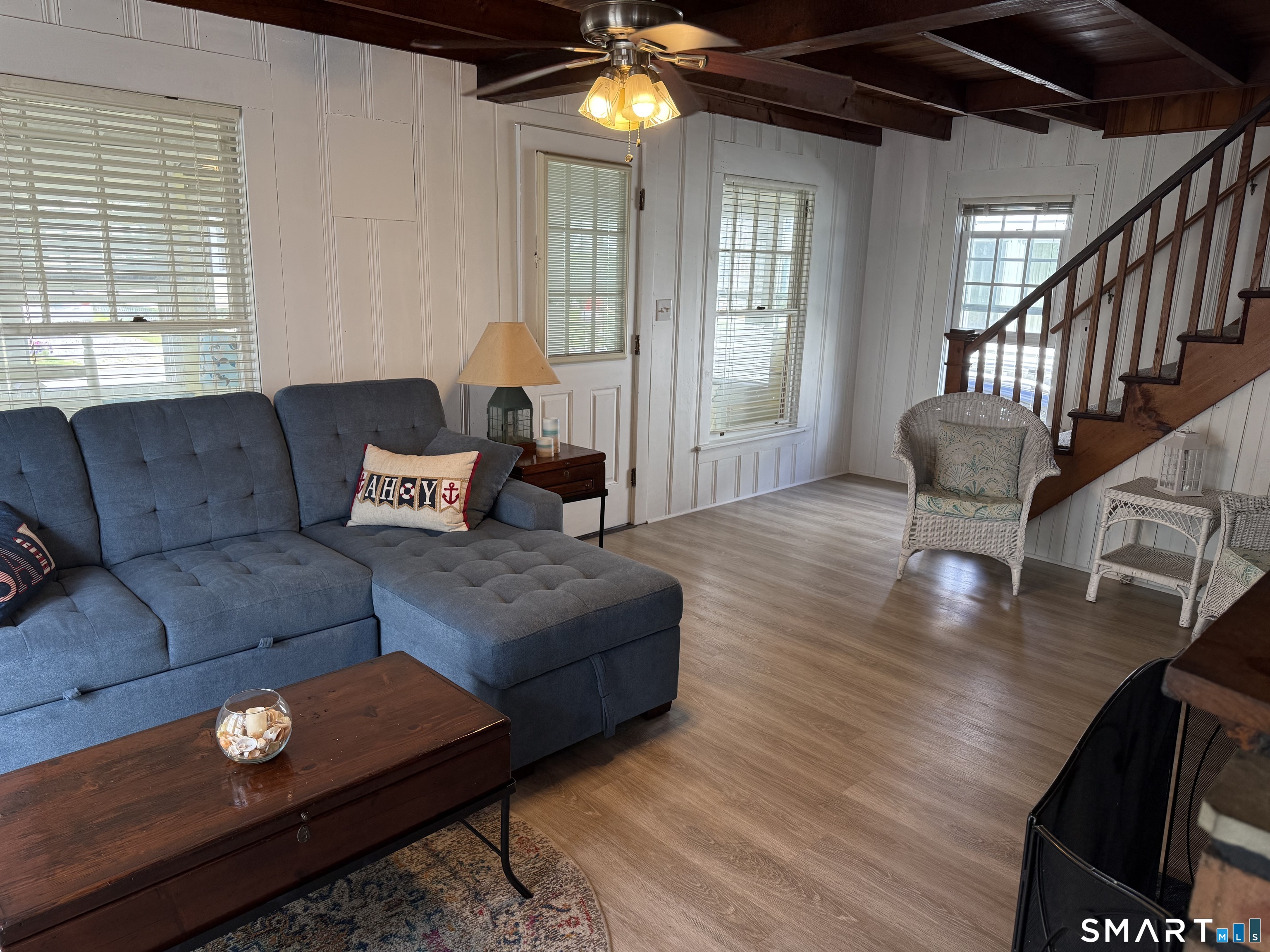 16 Springfield Road Old Lyme, CT 06371 - Photo 8 of 19 a living room with furniture and a chandelier