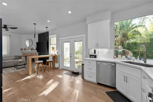 a kitchen with sink cabinets and outdoor view