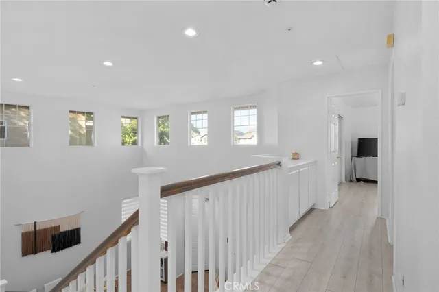 a view of a hallway with windows