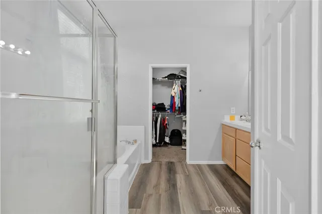 a view of a hallway with closet and a couch