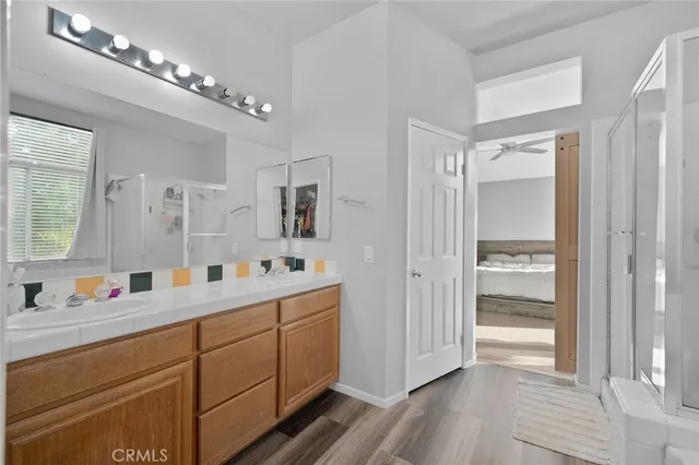 a view of a double sink and a mirror in a bathroom